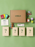 Box Signature Surprise LIVRE&O contenant quatre livres mystères, des sachets de thé, des gourmandises et des cadeaux.
